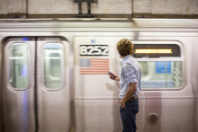 A Young Latin Man In The Subway
