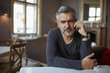 © Bratislav Nadezdic/Stocksy - Man holding phone