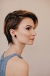 © Liliya Rodnikova/Stocksy - Profile portrait of young female with short haircut
