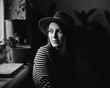 © Alexandr Ivanets/Stocksy - Female in hat looking away