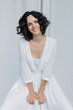 © Duet Postscriptum/Stocksy - Laughing young woman posing in dress
