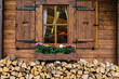 © Zocky/Stocksy - Wooden mountain hut with window decorated with flowers