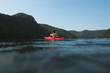 © RG&B Images/Stocksy - Man in kayak floating on mountain lake