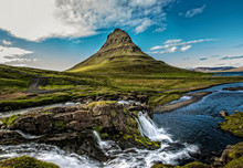 Waterfall With Mountain In Iceland