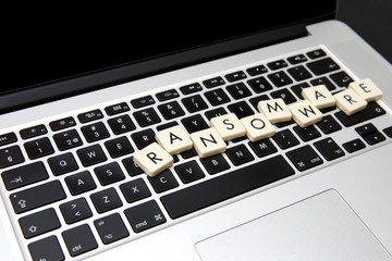 Wall Mural - ransomware text written with letters on a modern laptop. information security threat concept image.