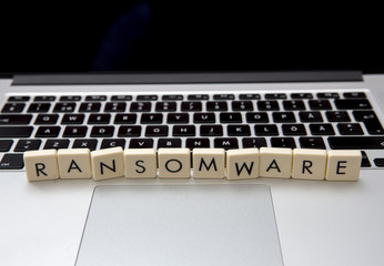 Wall Mural - ransomware text written with letters on a modern laptop. information security threat concept image.