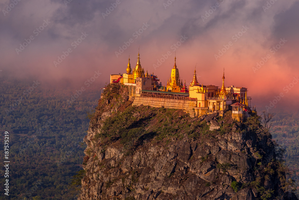 Taung Kalat Monastery on Mt. Popa, Myanmar at sunrise - obrazy, fototapety, plakaty 