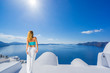 © Netfalls - Woman on Santorini's roof top