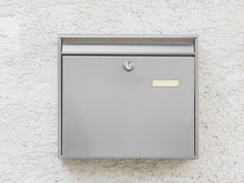 A Silver Mailbox On The Wall