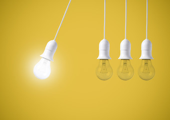 difference light bulb on yellow background. concept of new ideas with innovation and creativity.