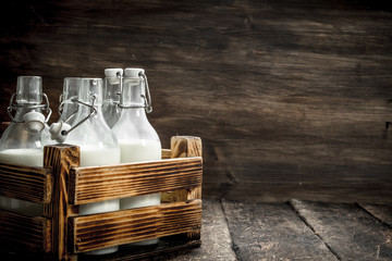 Bottles with fresh milk in a box.