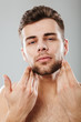© Drobot Dean - Close up portrait of a young bearded man