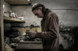 © Image Source - Mechanic working at workshop bench