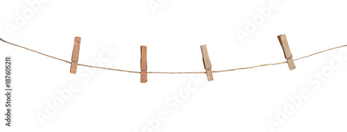 Fotomural Four wooden clothespins on a rope, isolated on white background
