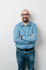 Wall Mural - Studio shot portrait of a happy middle-aged man