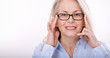 © missty - Middle aged business woman with eyeglasses in blue shirt isolated on white background