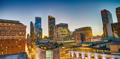 Poster - Midtown Manhattan skyscrapers as seen from city rooftop at sunset