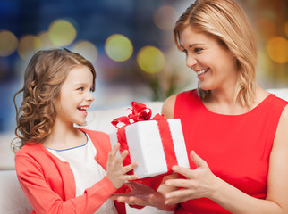 Wall Mural - happy mother and daughter with gift box