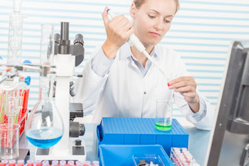 Poster - Experiments in the chemical laboratory, Female researcher using her test tube in a laboratory