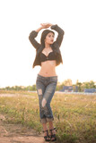 Premium Photo  Close up of sexy woman in black bra use hand touch mouth in  the field on sunset vintage styleorange tone concepthot girl model for biker