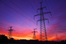 High-voltage Power Lines During Fiery Sunrise