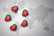 five hearts with national flag of eritrea on a world map background