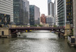 The Jackson Boulevard Street Bridge with traffic and Lake Michigan River surrounded by financial buildings, Chicago, IL, USA on the 5th of August, 2017