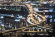© Cavan Images - High angle view of elevated roads in city at night