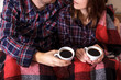 © NataliAlba - Young hands two cups hot plaid female man coffee shirt cage