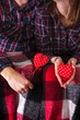 © NataliAlba - Love story Romance Couple plaid shirts holding red hands two hearts young loving man woman Valentine day
