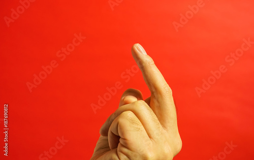 手の表現 中指を立てる 人を呼ぶ 喧嘩を売る 赤色背景 Stock Photo Adobe Stock