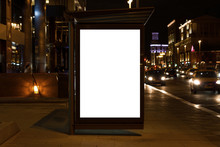 Blank White Mock Up Of Vertical Light Box In A Bus Stop At Night