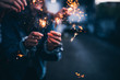 © Criene Images - Close-up of bright bruning sparklers in the night