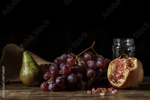 Cuadros en Lienzo Pictorial still life with grapes, pears and pomegranate.
