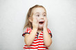 © Ilshat - Surprised little girl with open mouth and hands on cheeks
