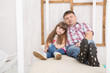 © ulza - happy daughter hugging father in the kid bedroom. Happy family spending time at home.85 / 200 characters* Keywords:a