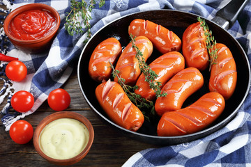 Wall Mural - fried sausages with ketchup and aioli sauce