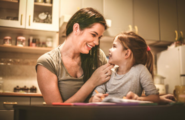 Wall Mural - Mother spending time with her daughter. Close up.