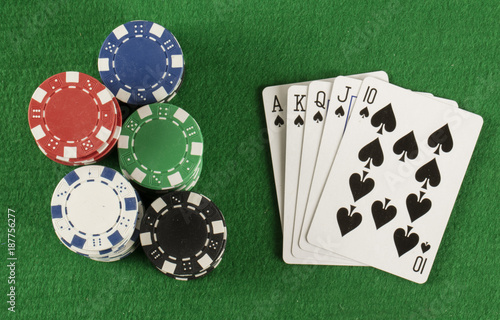 poker game with chips on green background плакат