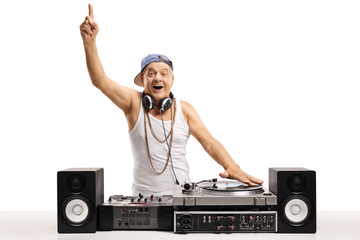 Poster - Cheerful old DJ playing music on  a turntable and holding his finger up