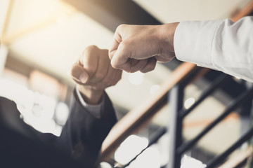 Aufkleber - Teamwork of businessman partnership giving fist bump to greeting start up business strategy project
