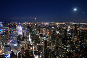 Wall Mural - New York City skyline aerial panorama view at night with  Times Square and skyscrapers of midtown Manhattan.