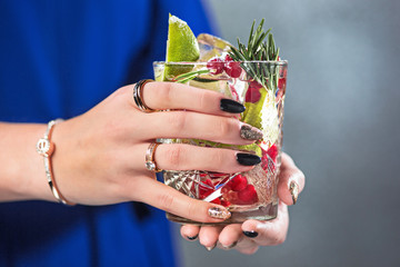 Wall Mural - The exotic cocktail and female hands