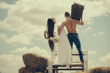 Wall Mural - Man hold wicker basket with hay