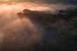© Kostadin Luchansky - Floresta virgem de miombo ao longo do Cubango de madrugada vista do ar. Angola