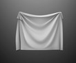 Hanging empty white flag. Fabric cloth texture with shadow on background.