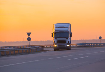 Canvas Print - Truck move in evening on highway