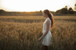© Vyacheslav Chistyakov/Blend Images - Pensive Caucasian girl standing in field of wheat