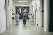 © FS Productions/Blend Images - Nurse holding hands with girl in hospital