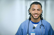 © FS Productions/Blend Images - Portrait of smiling mixed race nurse